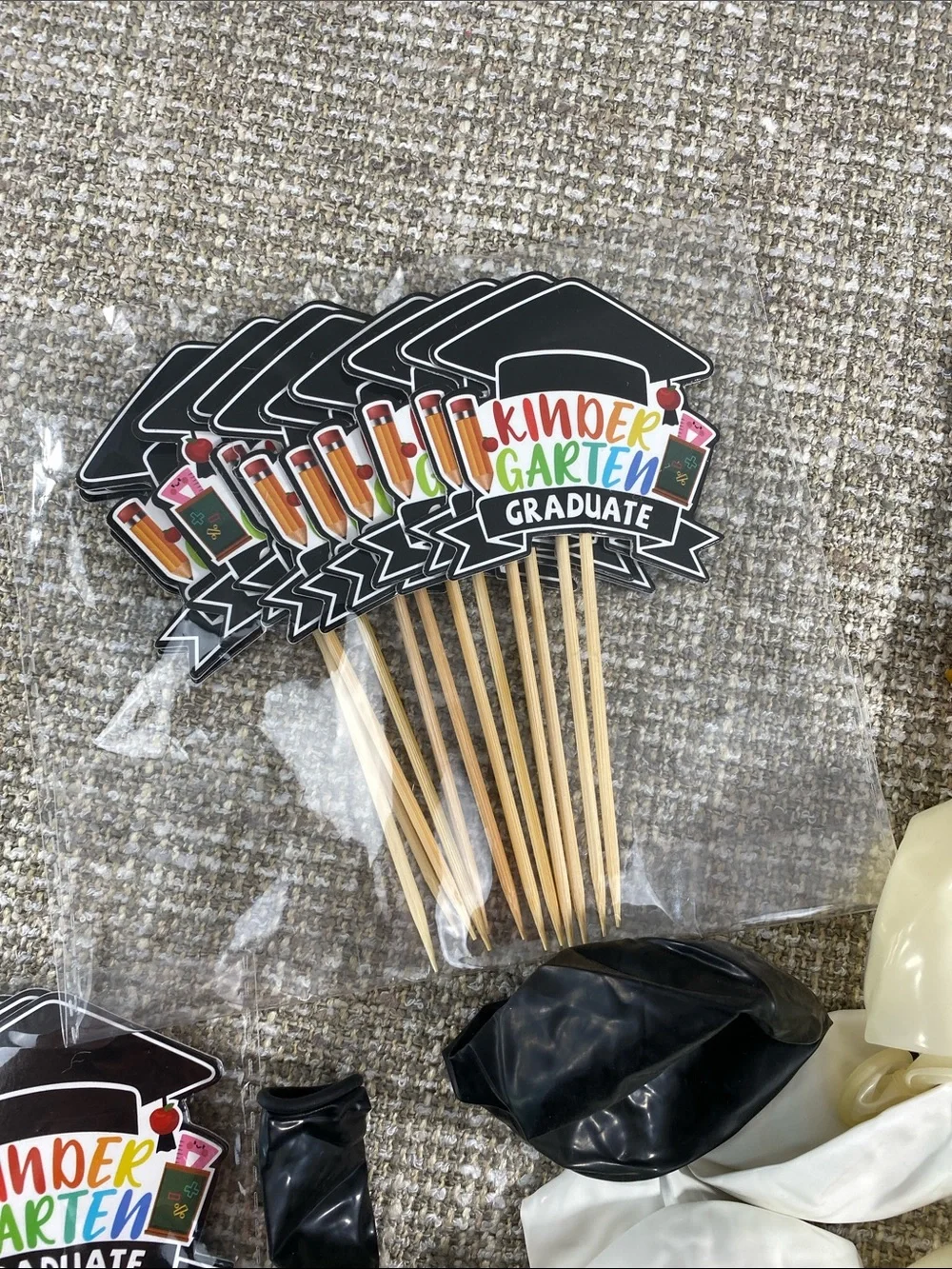 Kindergarten graduation balloons and cupcakes toppers.